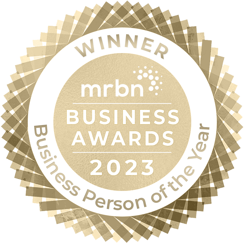 MRBN Awards Badge 2023 Winner Business Person of the Year - Gold and white circular badge displaying