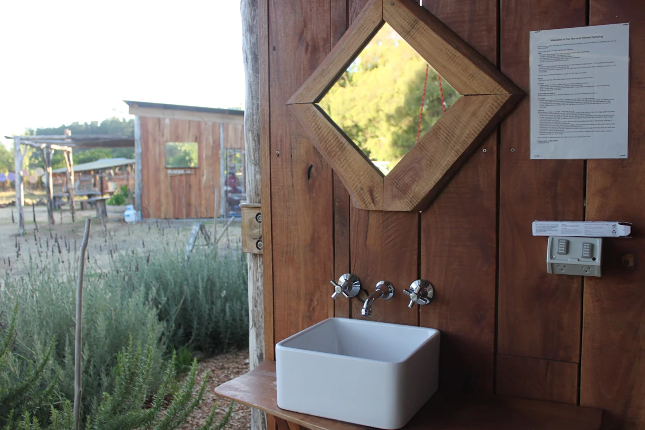 Rustic outdoor wooden sink with diamond mirror